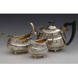 Three-piece silver London shaped tea set, Nathan & Hayes, Chester  1911, 33oz 15dwt.