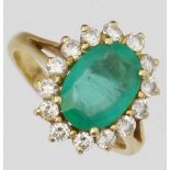 Emerald and diamond oval cluster ring, the central stone 11.45 x 8.06 x 4.35mm, surrounded by