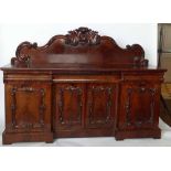 Victorian mahogany sideboard, the scrolled back over three apron drawers and four doors, length