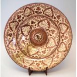 Hispano Moresque charger, with raised centre painted with leaves and palmettes in copper lustre,