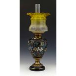 Victorian floral pottery oil lamp, height to burner 37cm, with yellow glass shade.
 
Condition