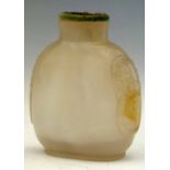 Pale grey chalcedony snuff bottle suffused with an orange cloud, taotie side handles, green stone
