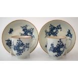 Two Worcester cups and saucers circa 1780   printed with fruit sprays in blue transfer, crescent