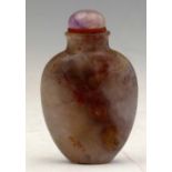 Cloudy agate snuff bottle of pale purple ground with reddish inclusions and a purple quartz cap,