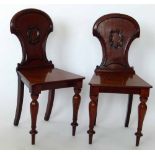 Pair Victorian mahogany hall chairs.