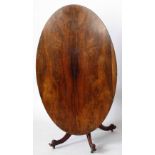 Victorian rosewood oval centre table, the tip top on four outswept legs, length 160cm. Condition