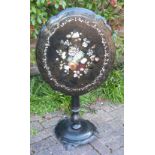 Victorian papier mache tip top table, the shaped oval top painted and inlaid with a floral spray, on