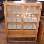 Early 20th century oak display cabinet on open base. Condition report: see terms and conditions