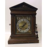 Oak cased mantel clock with key. Condition report: see terms and conditions