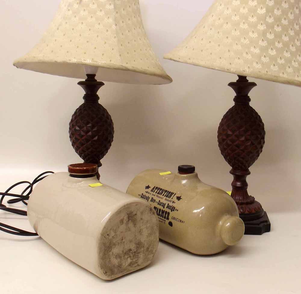 Two stone hot water bottles and a pair of modern table lamps. Condition report: see terms and