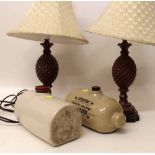 Two stone hot water bottles and a pair of modern table lamps. Condition report: see terms and