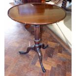 George III mahogany dished top tripod table. Condition report: see terms and conditions