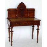 Victorian mahogany writing table with a high back and inset skiver over three drawers, width