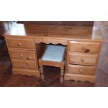 Modern pine knee-hole dressing table enclosing six drawers and dressing stool. Condition report: see