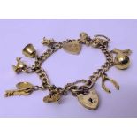 99 yellow gold charm bracelet, 23.4g. Condition report: see terms and conditions