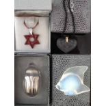 Two Lalique boxed necklaces, modelled as a Star of David, the other with two cherubs, also two other