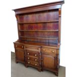 Victorian mahogany and pine North Wales enclosed dresser with boarded plate rack, width 170cm .