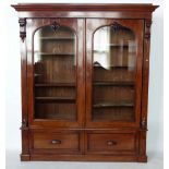 Mahogany tall bookcase enclosed by two glazed doors, width 180cm.