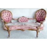 Victorian walnut show frame double chair back settee upholstered in buttoned pink velvet on French