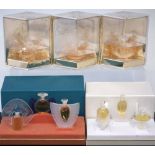 Three Lalique boxed perfume sets, each containing three full bottles from the 'Ultimate