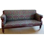 Victorian mahogany show frame settee upholstered in floral tapestry on stout reeded legs, length