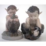 Two Royal Copenhagen Fauns, modelled with pet snake and frog, models 1712, and 1713, (2) 11cm high