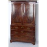 George III mahogany linen press, the upper part of two panelled doors enclosing two drawers and