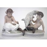 Two Royal Copenhagen Fauns, modelled with pet rabbit and goat, models 439, and 498, (2) 12.5cm high