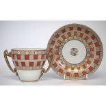 Chocolate cup and saucer attributed to Pinxton circa 1800   with biting snake handles, decorated