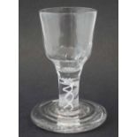 Firing glass circa 1780 with moulded bowl, opaque twist stem, and thick ribbed foot, 9.5cm