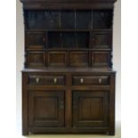 Oak Denbigh dresser mid 18th century, the boarded and canopied plate rack back with six small