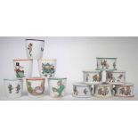 Six Shelley Mabel Lucie Attwell napkin rings and six egg cups, decorated with pixies and figures, (