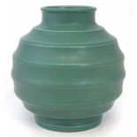 Wedgwood Keith Murray vase   moulded with horizontal flutes decorated with a green glaze, 18cm high