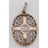 Antique gold and diamond oval locket set with rose cut stones and a windowed back, overall length