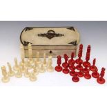 Red and white bone chess set (32 pieces), 19th century, king height 99mm, housed in a white