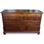 Oak mule chest banded in mahogany circa.1780, the rising top over false drawer fronts flanked by