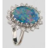 Oval opal doublet within a band of diamonds, set in 18ct white gold, ring size M+, gross weight 4.