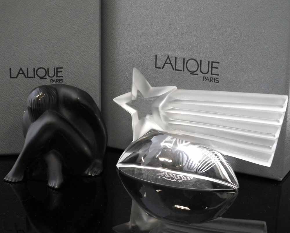 Two Lalique boxed models, to include seated nude, in black glass, 5.5cm high and a 2000