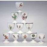 Ten Shelley Mabel Lucie Attwell design footed egg cups, decorated with pixies and figures, also a