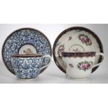 Two Worcester cups and saucers circa 1780   one painted with floral groups within blue and gilt