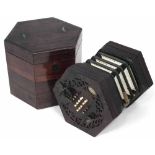 C. Wheatstone concertina with pierced rosewood frame and 32 keys, serial number 1521, with