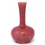 Burmantoft vase, incised with stylised motifs and decorated with a deep pink glaze, impressed