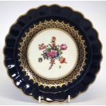 Worcester plate circa 1770   painted with polychrome floral sprays within navy blue and gilded