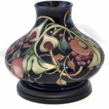 Moorcroft lamp, decorated with Queen's Choice pattern after Emma Bossons, blue felt capped wood