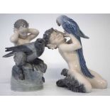 Two Royal Copenhagen Fauns, modelled with pet crow and parrot, models 2113, and 752, (2) 17cm high