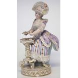 Meissen figure of a lady  modelled standing dealing cards, incised F64, impressed 44 and painted