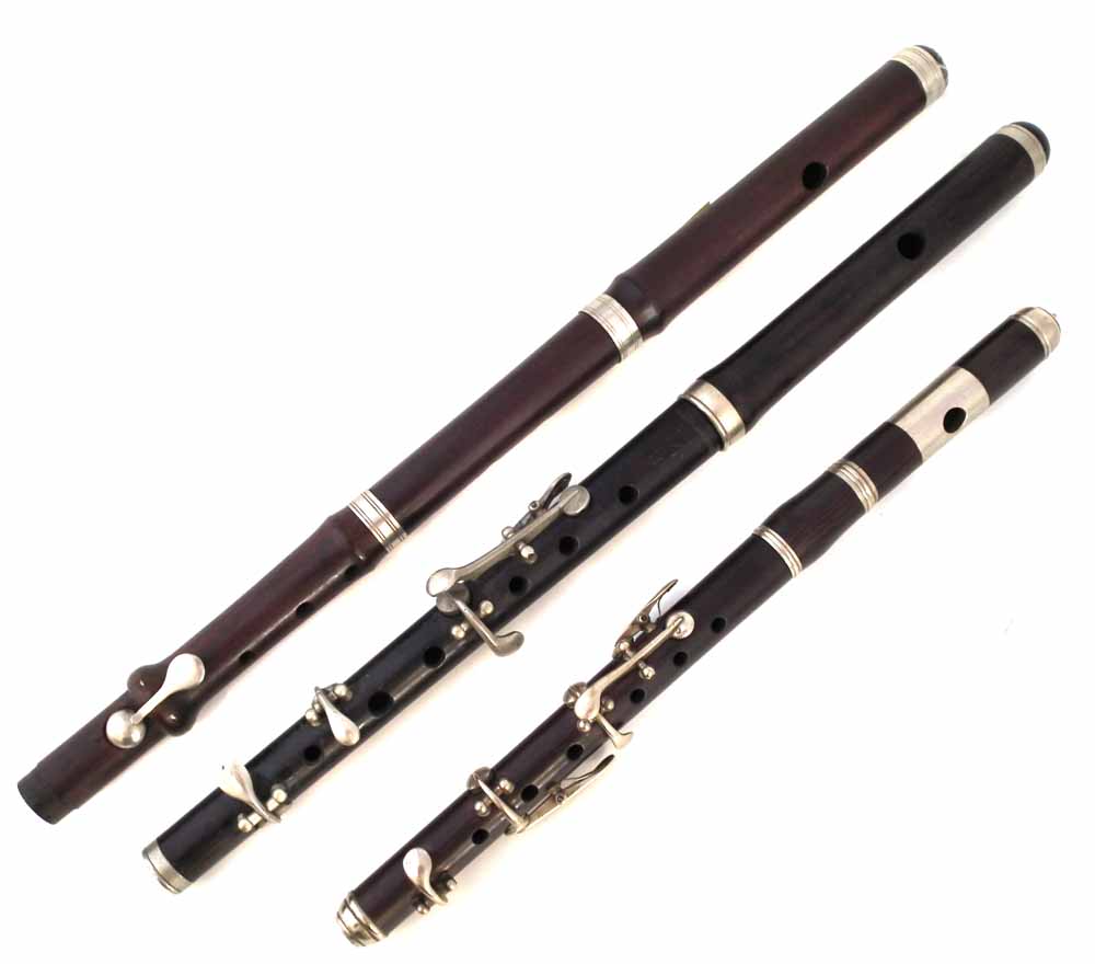 Two rosewood Fifes and a Piccolo, one stamped with a Military arrow, '1955 and Miller Browne London'