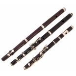 Two rosewood Fifes and a Piccolo, one stamped with a Military arrow, '1955 and Miller Browne London'