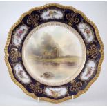 Royal Worcester plate signed J. Stinton,   painted with Inverlochy Castle with blue floral border,