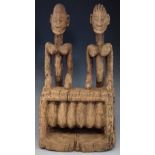 Dogon couple carved playing a balafon, 42cm high       All lots in this Tribal and African Art